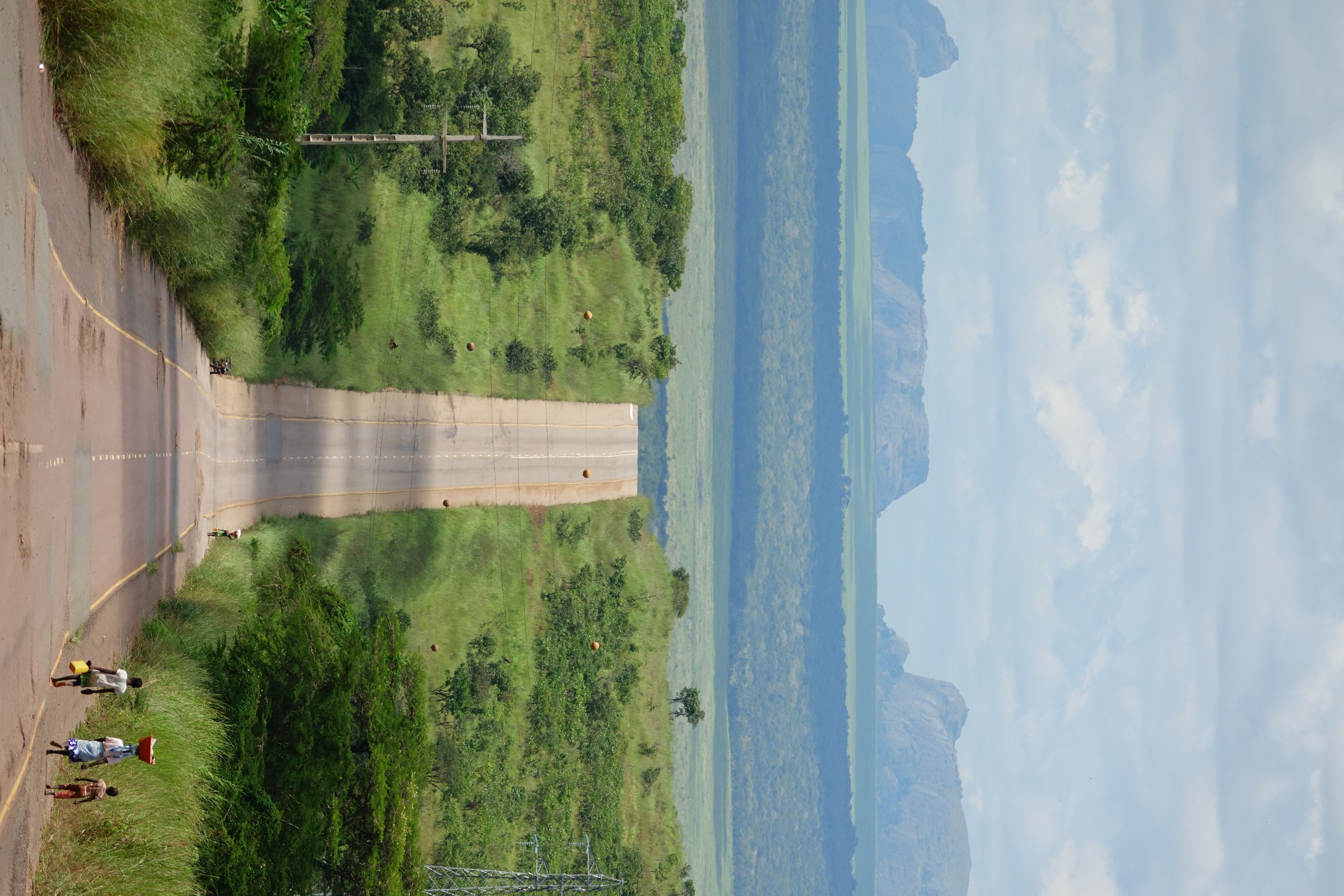 Road near the Pedras Negras de Pungo Andongo, with the black conglomerate pinnacles rising over the savanna