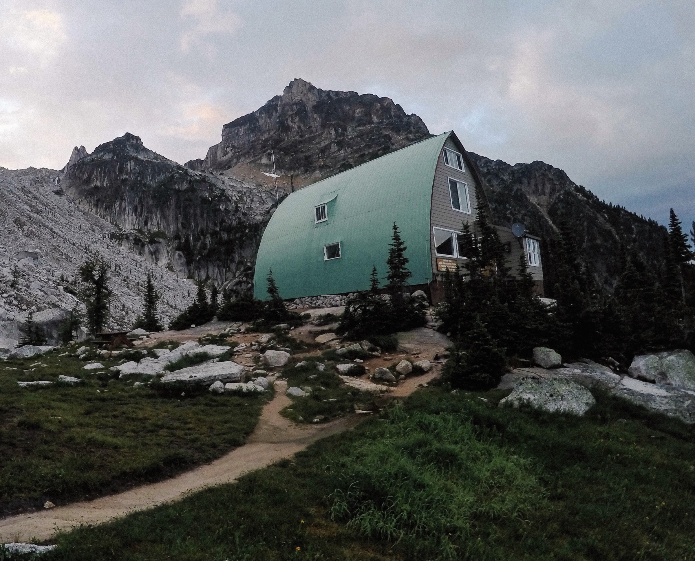 Conrad Kain Hut on its bench beneath the Bugaboo Spires