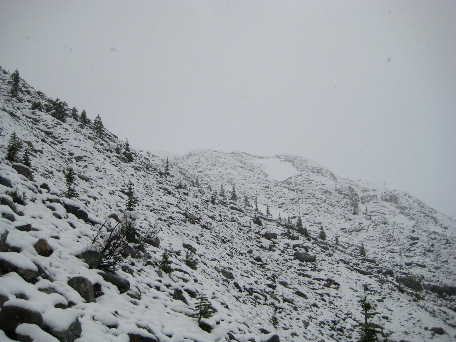 The Alpine Club of Canada's Asulkan Cabin perched on the col below Young Peak, Glacier National Park