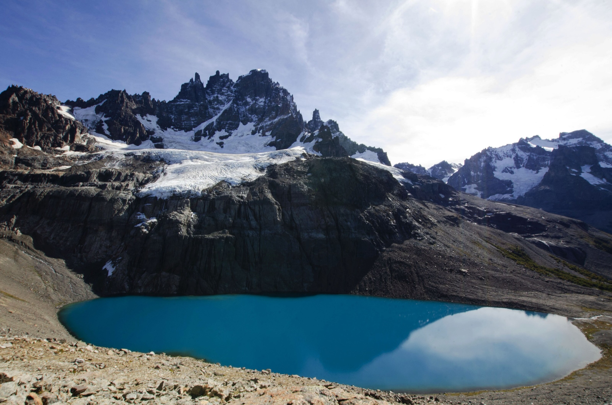 The turquoise lagoon under the basalt spires of Cerro Castillo in Aysén