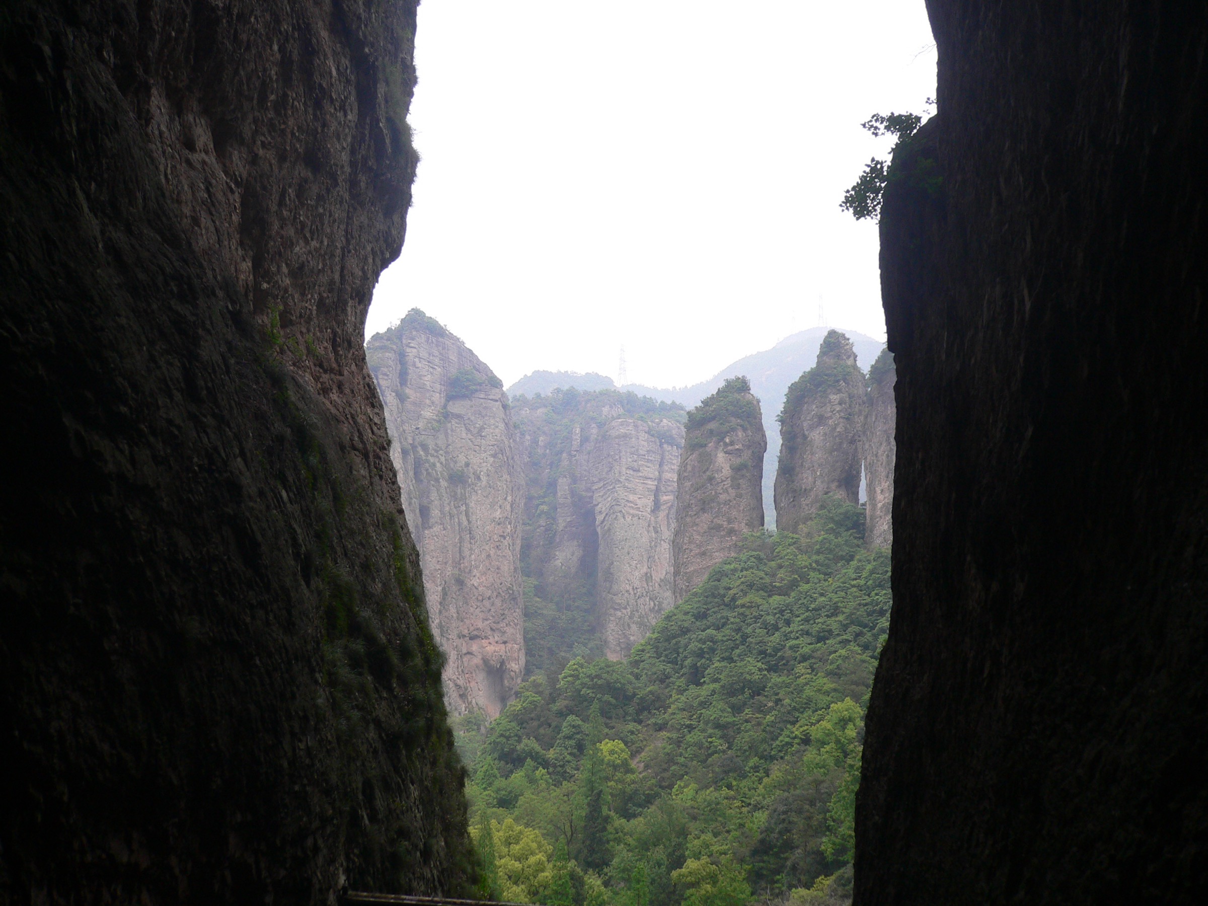 Twin Bamboo Peaks framed by the entrance of Guanyin Cave in the Lingfeng scenic area, Yandang Shan