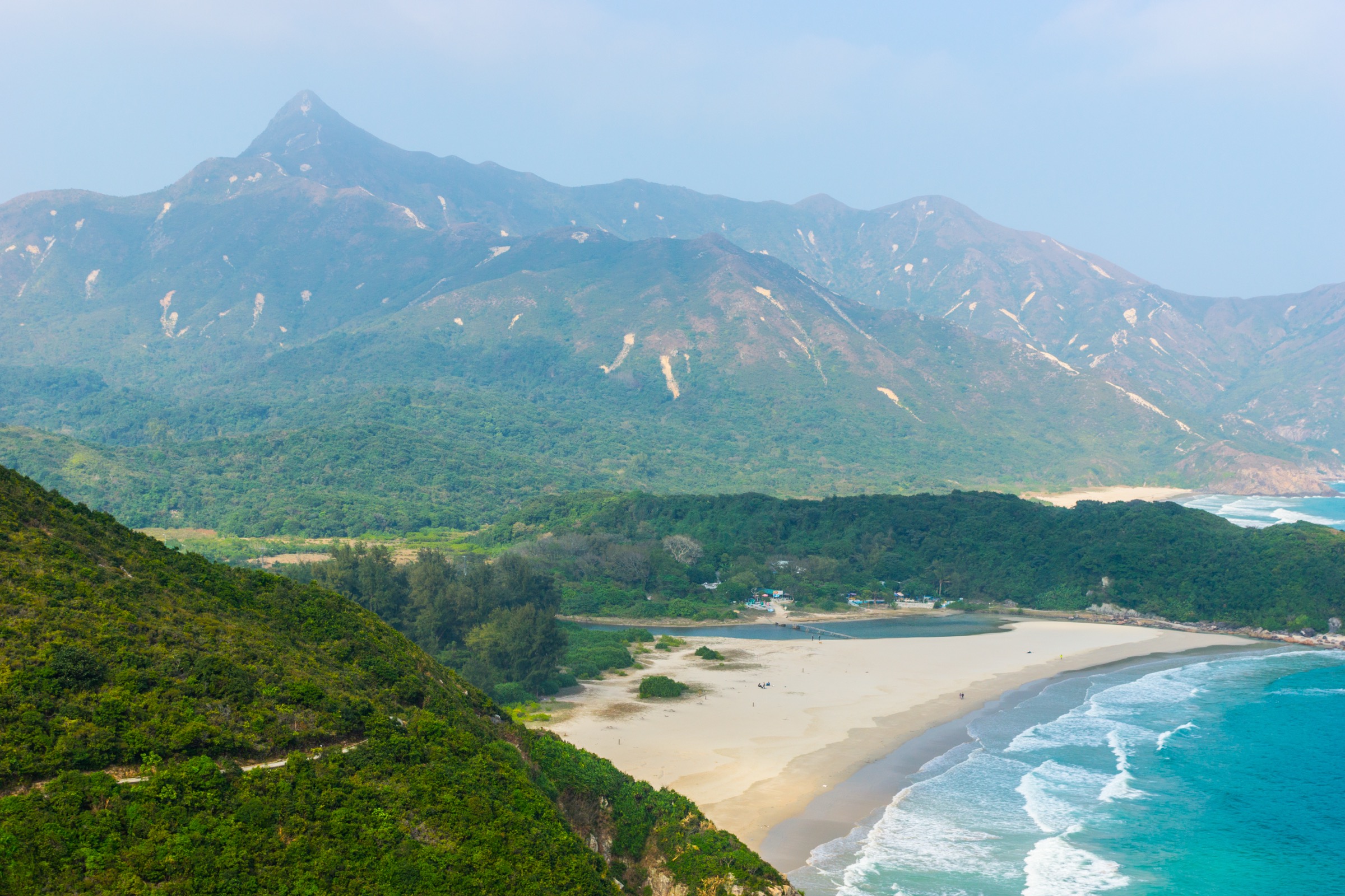 Sharp Peak rising above the Ham Tin Wan beach on the Sai Kung peninsula