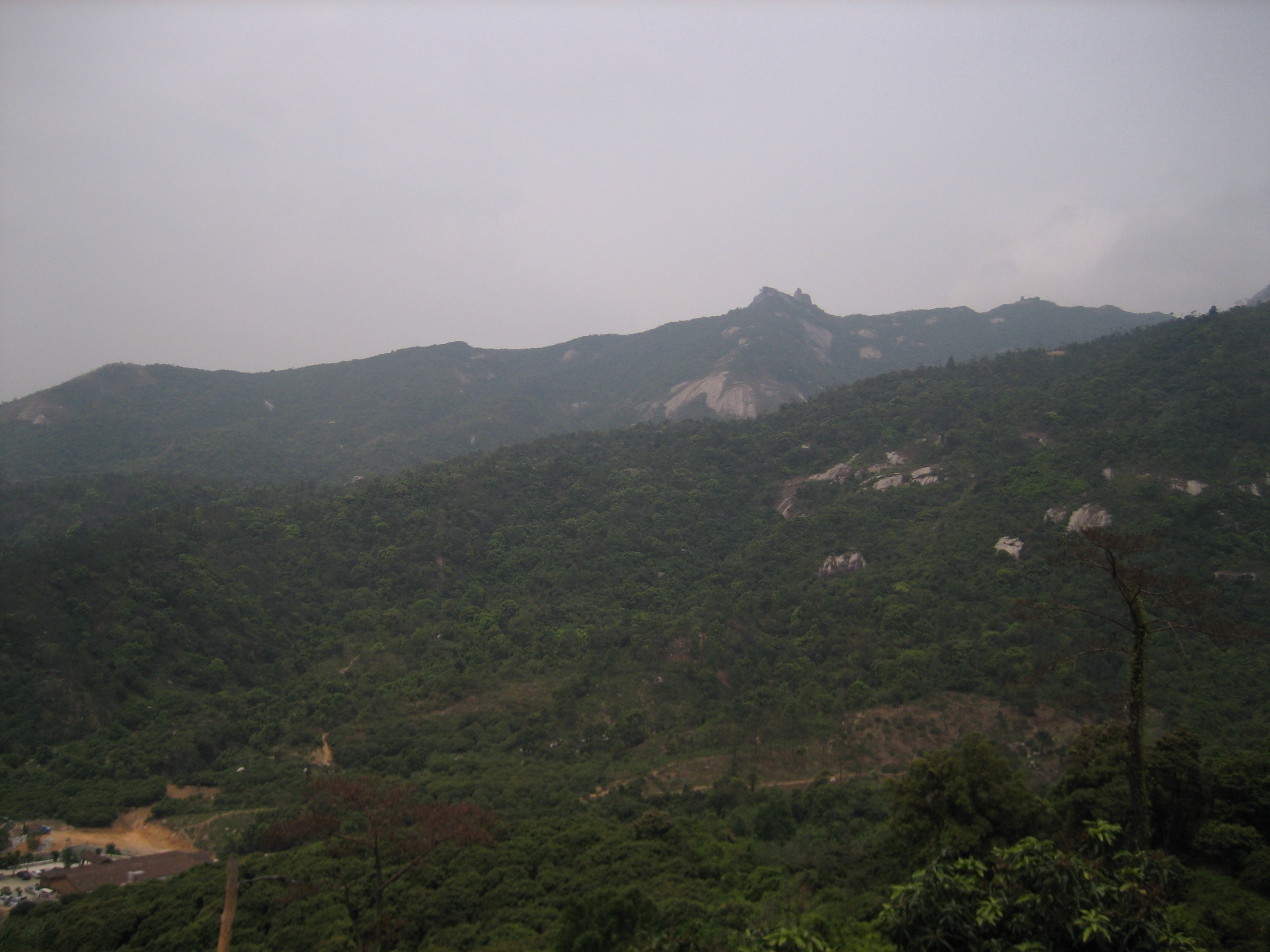 Forested ridges of Luofu Shan (罗浮山, 1,296 m) above Huizhou, the highest summit on the eastern margin of the Pearl River Delta uplands