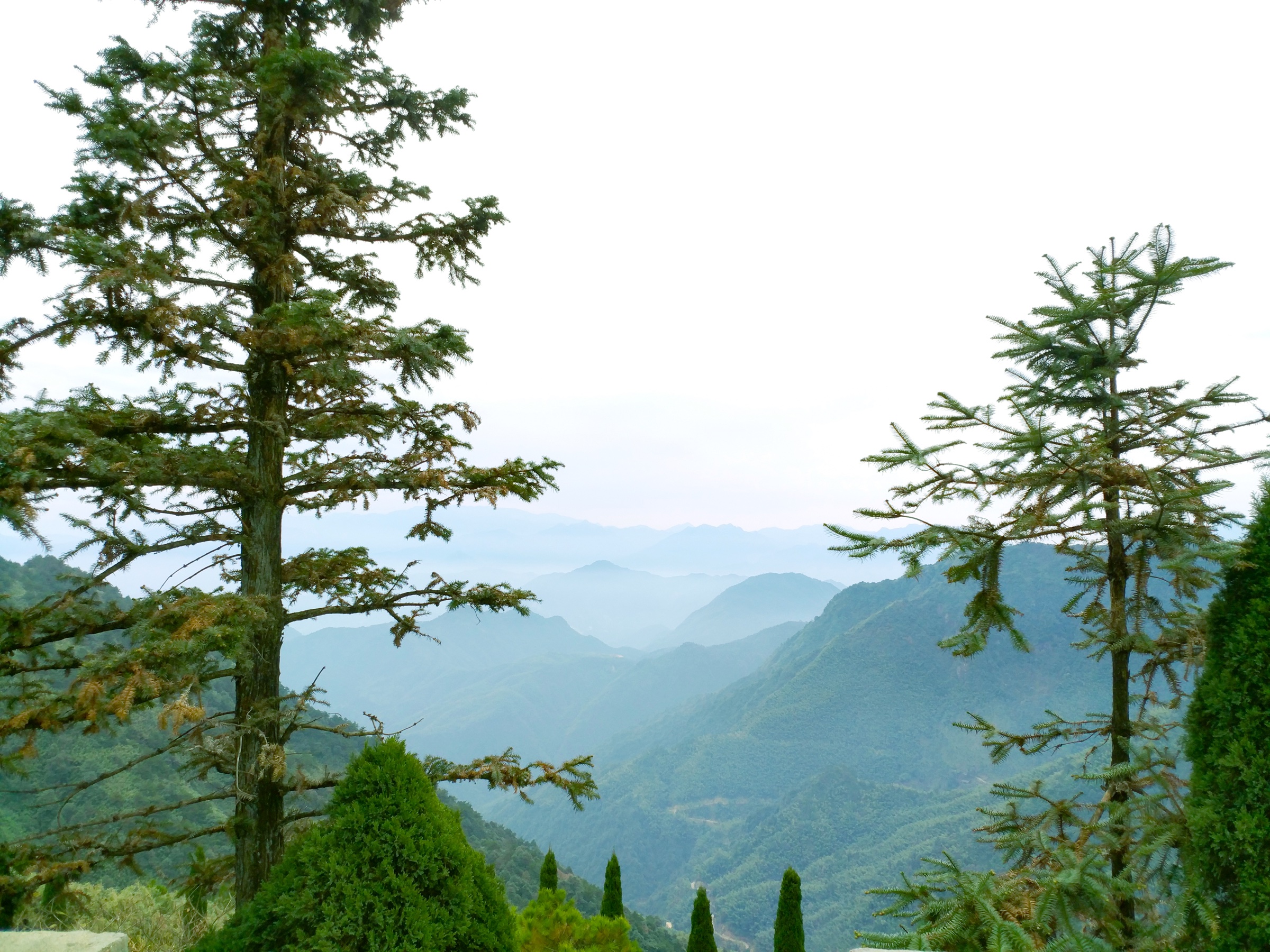 Upper trail and forested ridge on Mount Gexian, Yanshan County