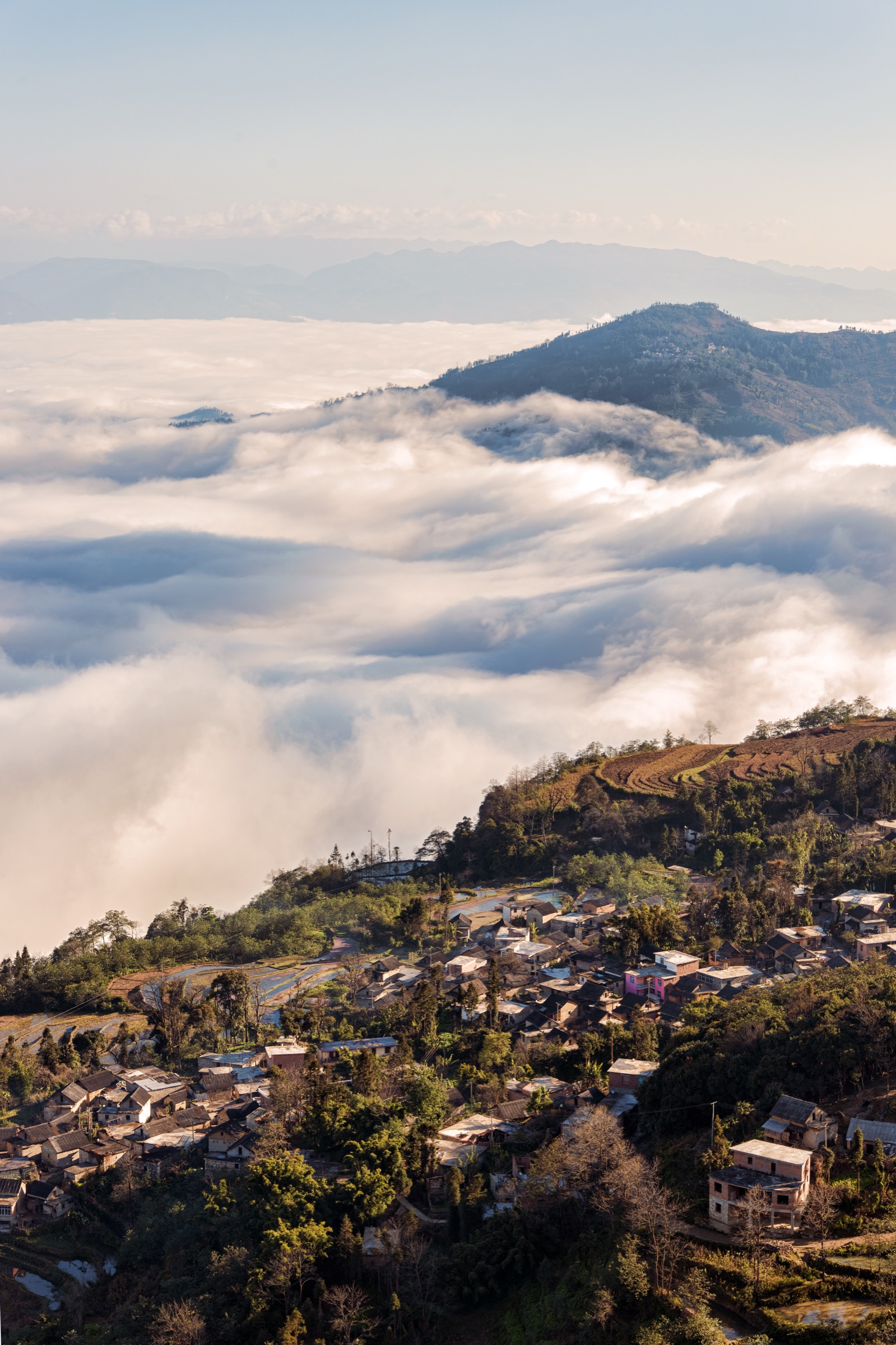 Sea of clouds over the Paozhuzhai terraces in the Laohuzui sector of Yuanyang
