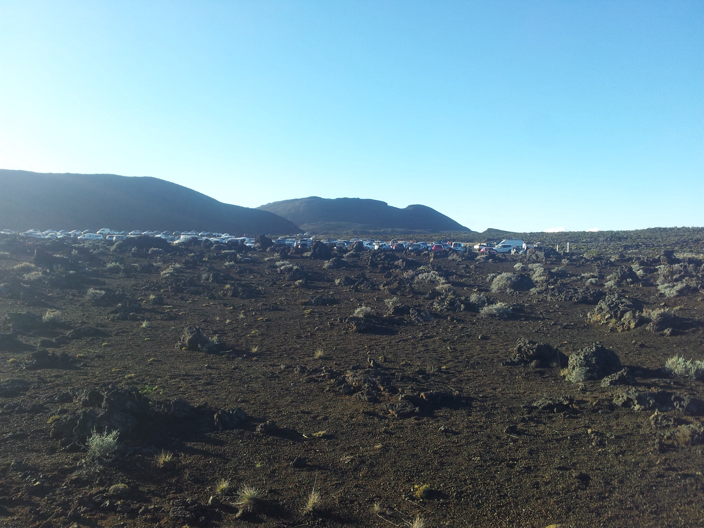 Parking area and access for the Piton de Bert trailhead off the route forestière du Volcan