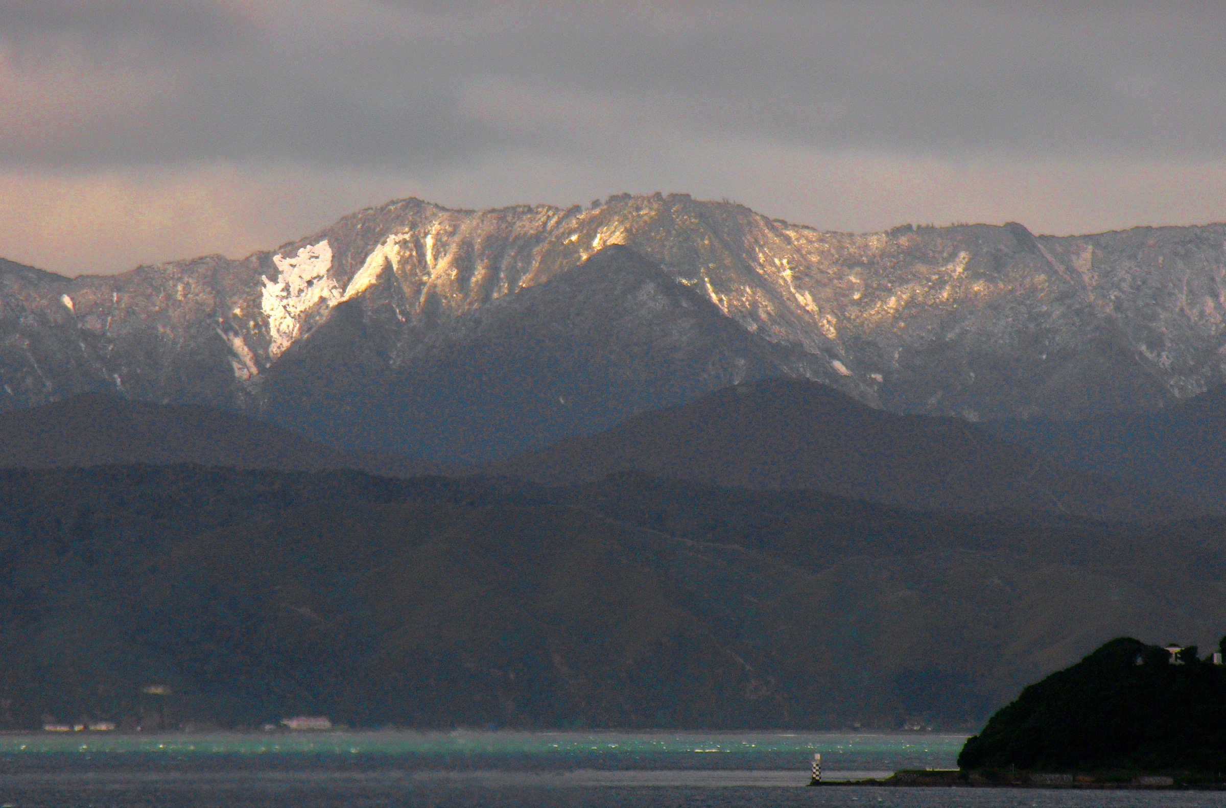 Snow-dusted Remutaka Range including Mount Matthews, viewed from Wellington across the harbour