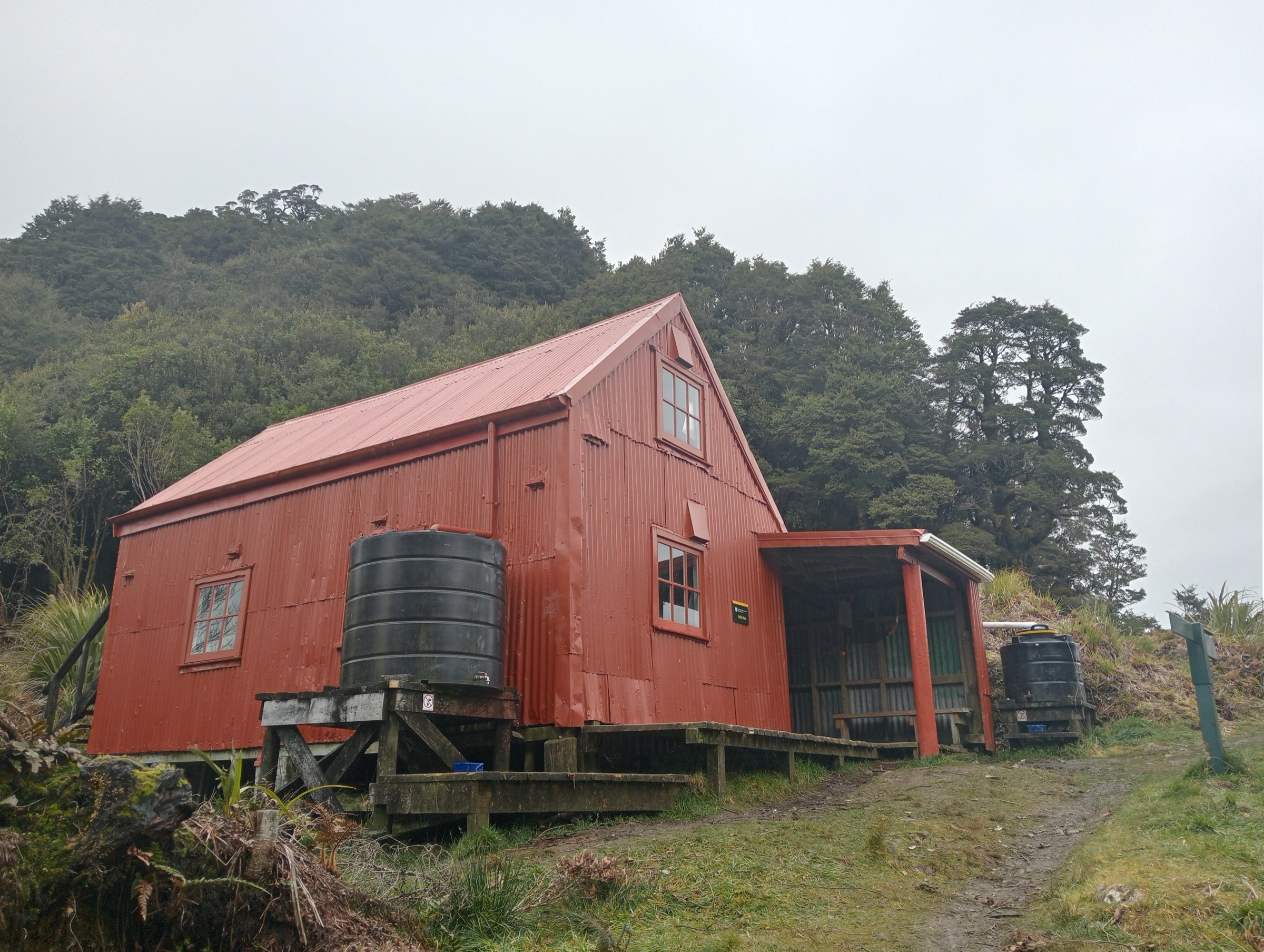 Field Hut in cloud below the bushline, western Tararua Range