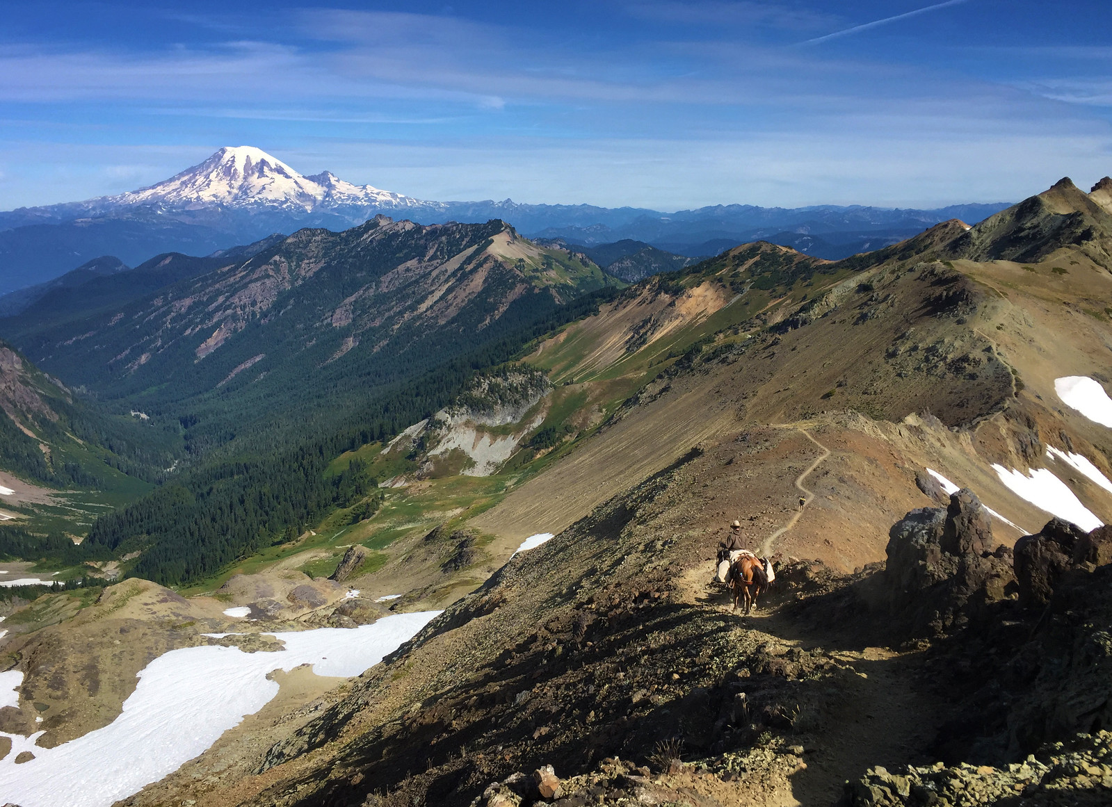 A thru-rider on the exposed Knife's Edge ridge in Goat Rocks Wilderness, Washington