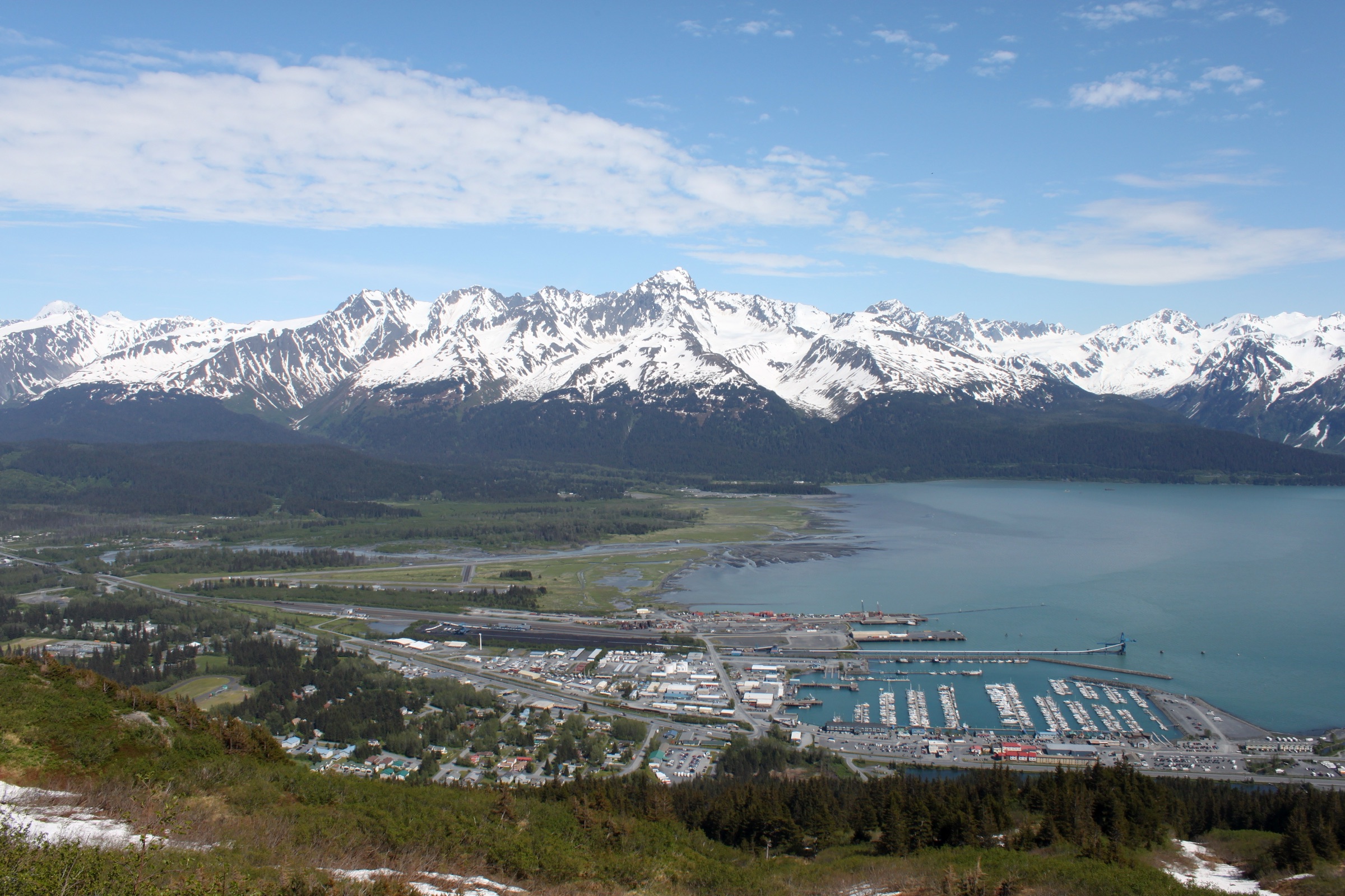 Hikers descending from the Mount Marathon bowl above Seward, Alaska