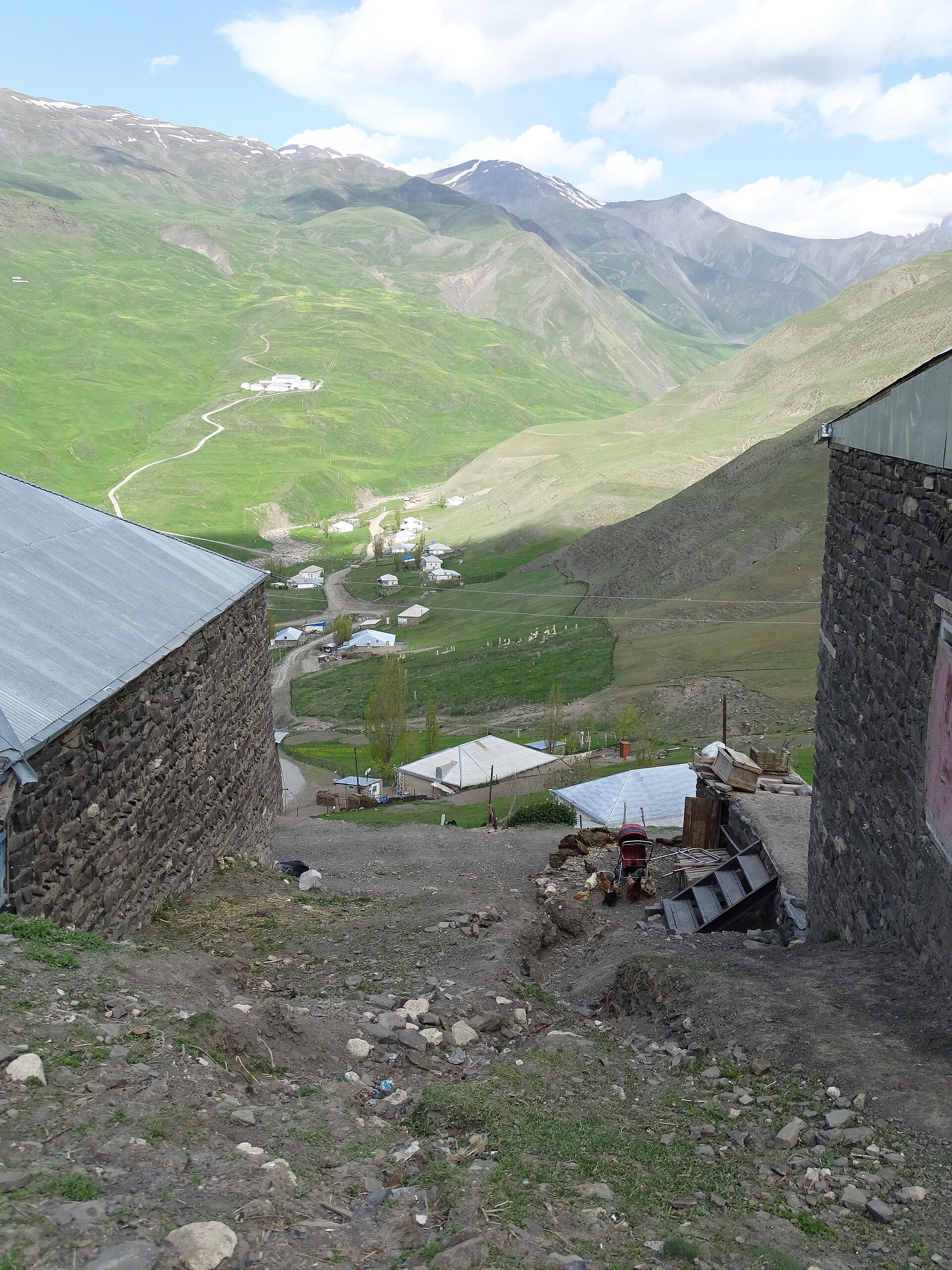 Stone and earth houses clustered on the steep hillside at Khinalig
