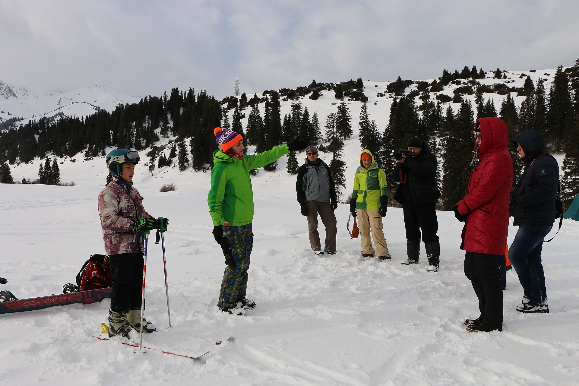 Ski tourers practising avalanche rescue in deep snow at Jyrgalan