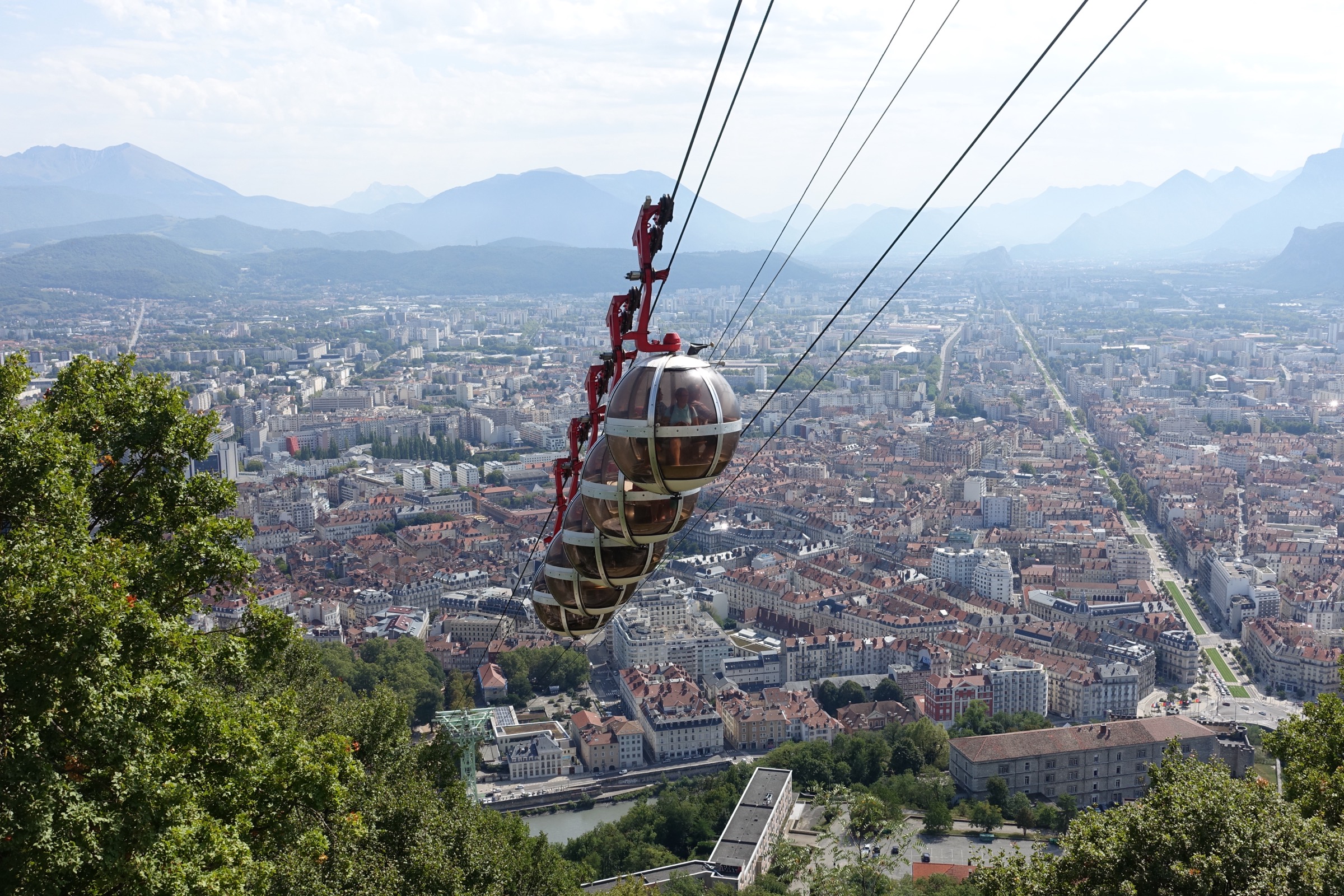 Round spherical cabins of the Grenoble Bastille cable car above the Isère valley
