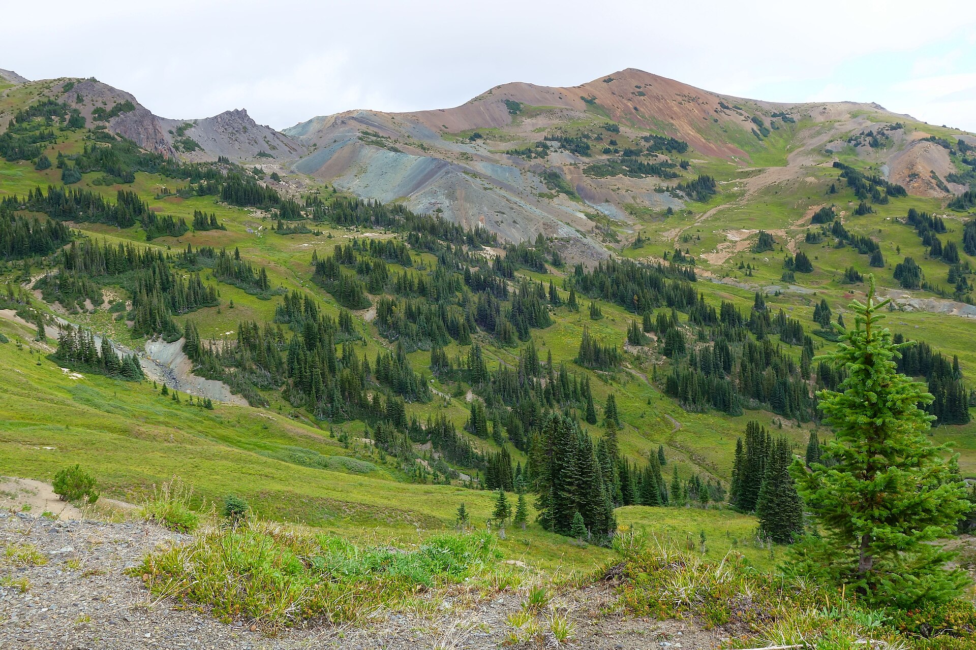 Red and ochre slopes surrounding Cinnabar Basin in the Rainbow Range
