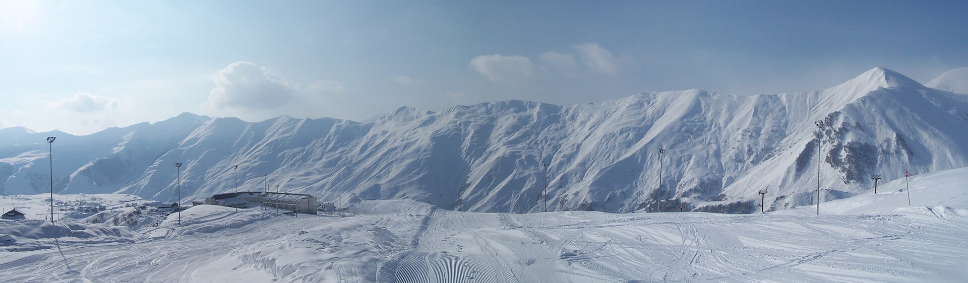 Panoramic view of a long snow-covered ridge above Gudauri