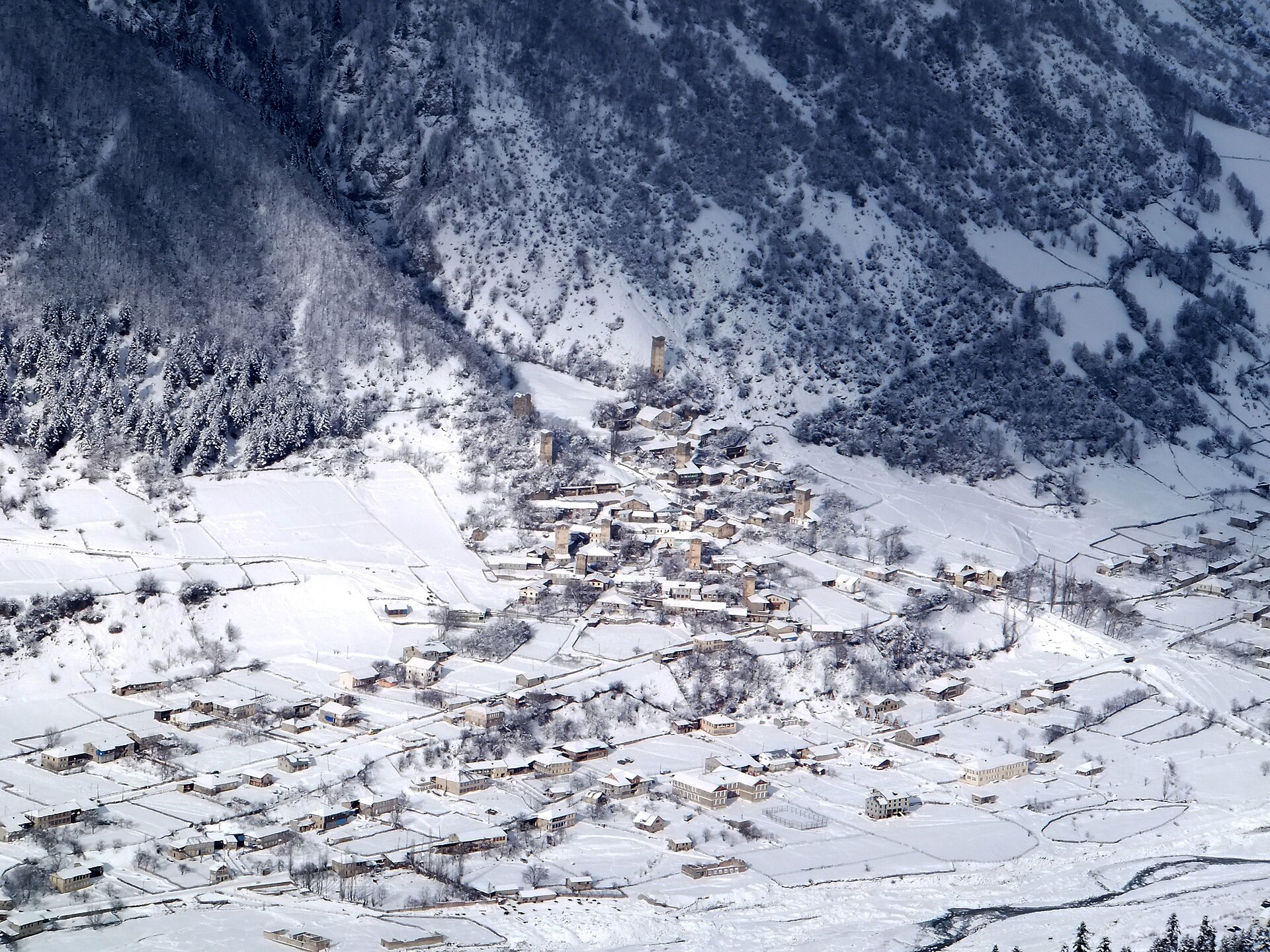 The Lagami district of Mestia and its Svan towers seen from above in winter