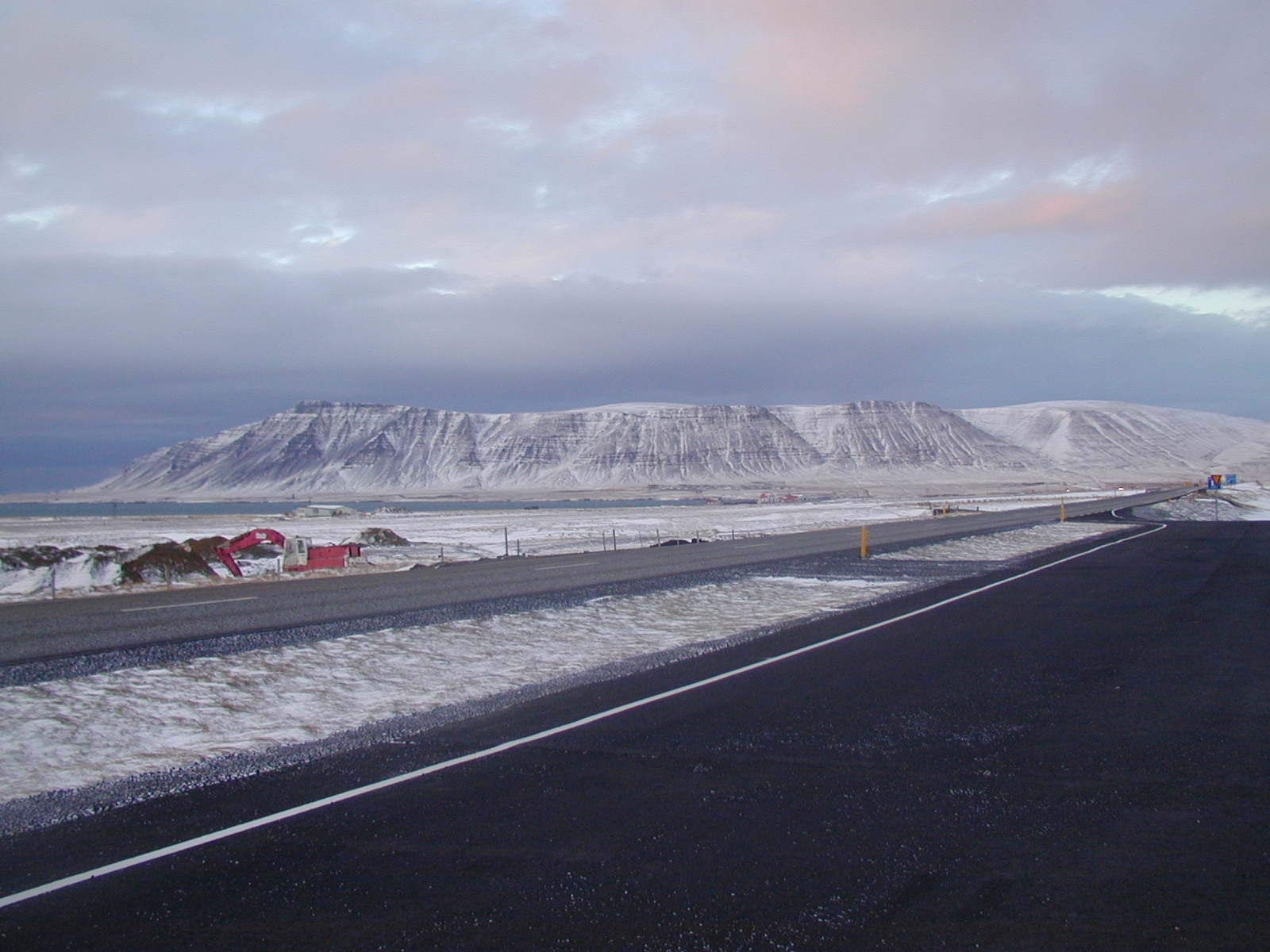 Hafursfell rising above a snow-covered Snæfellsnes road
