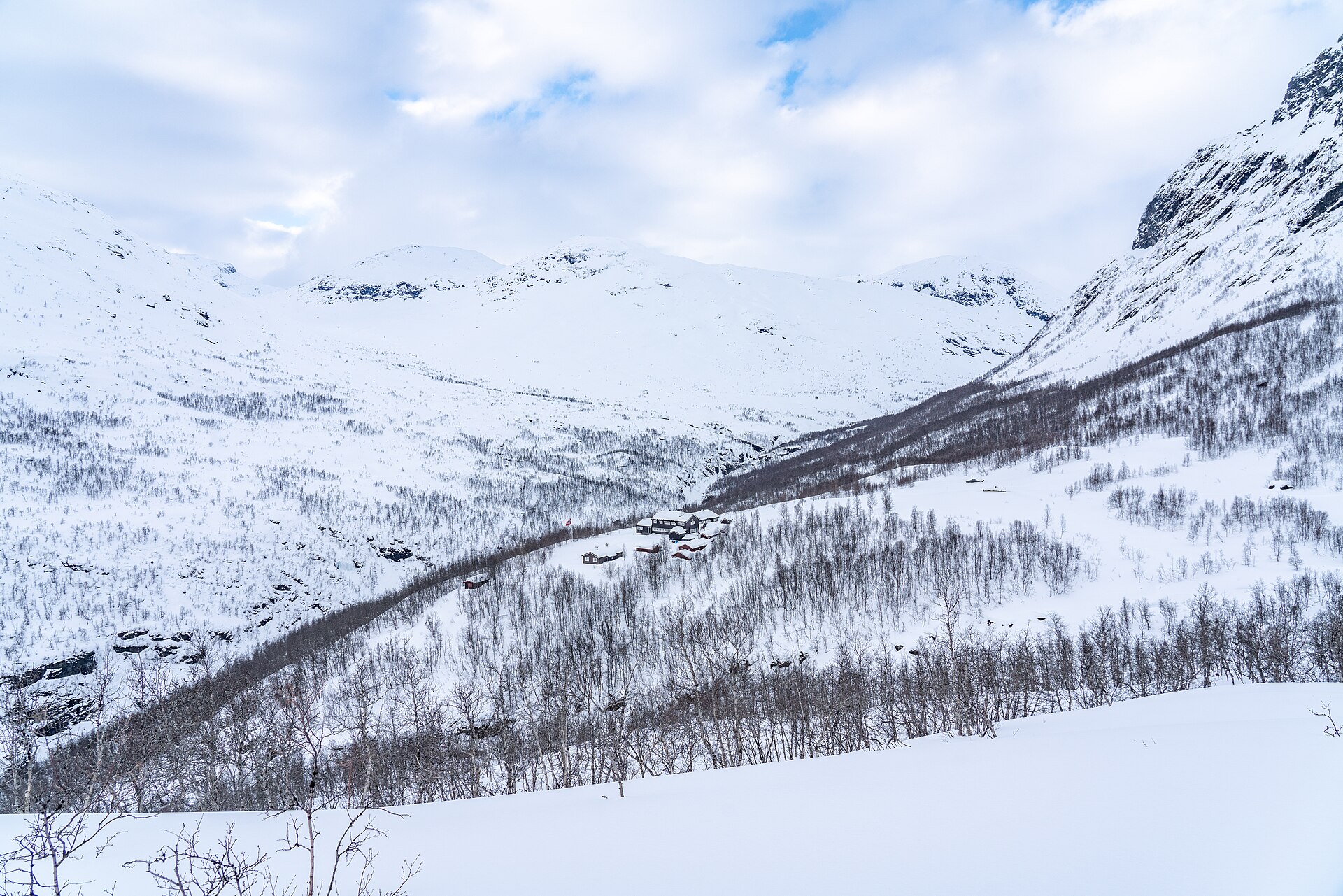 The Skogadalsbøen DNT mountain cabin surrounded by deep winter snow
