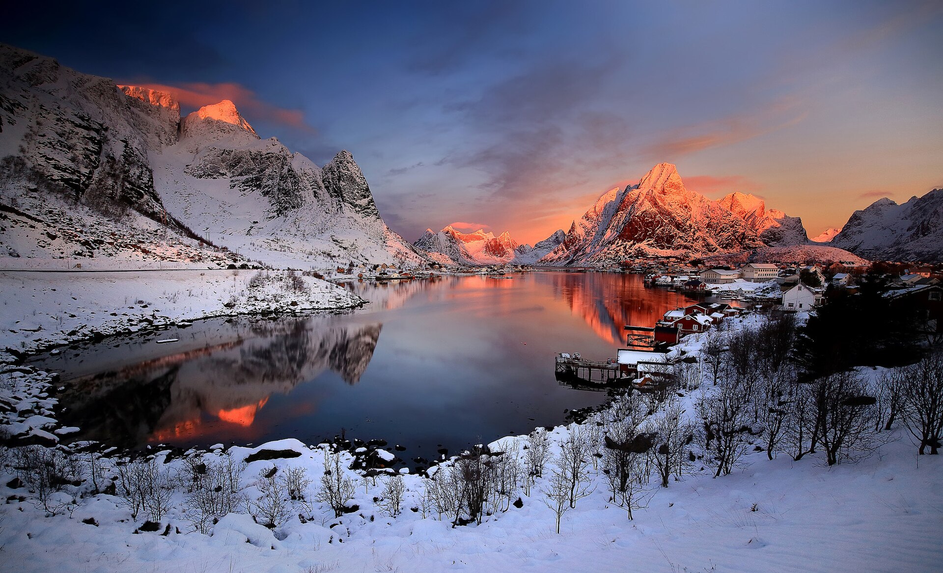 Sunrise illuminating Reine and the jagged mountains of Lofoten