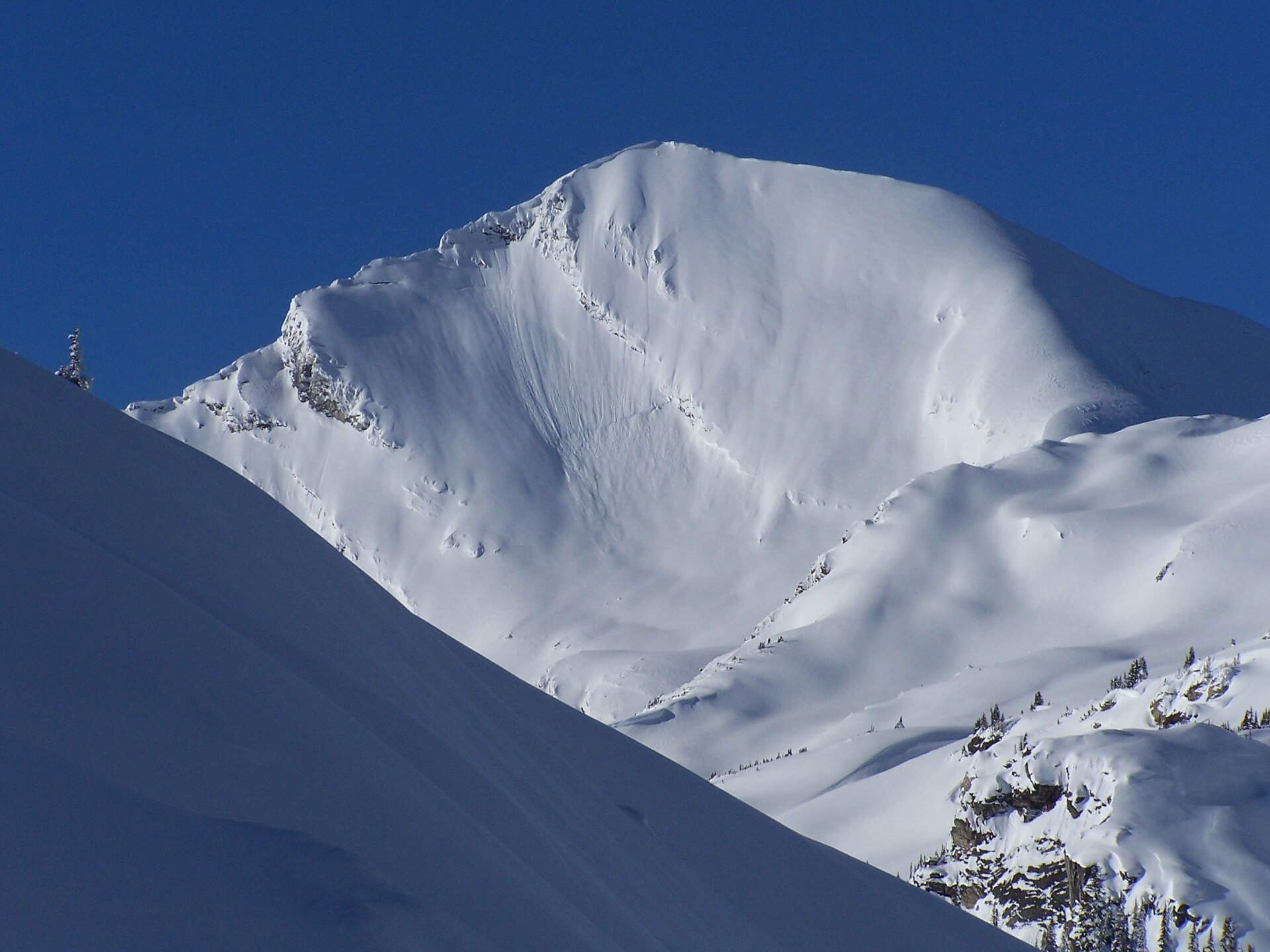 Catamount Peak covered in winter snow in Glacier National Park