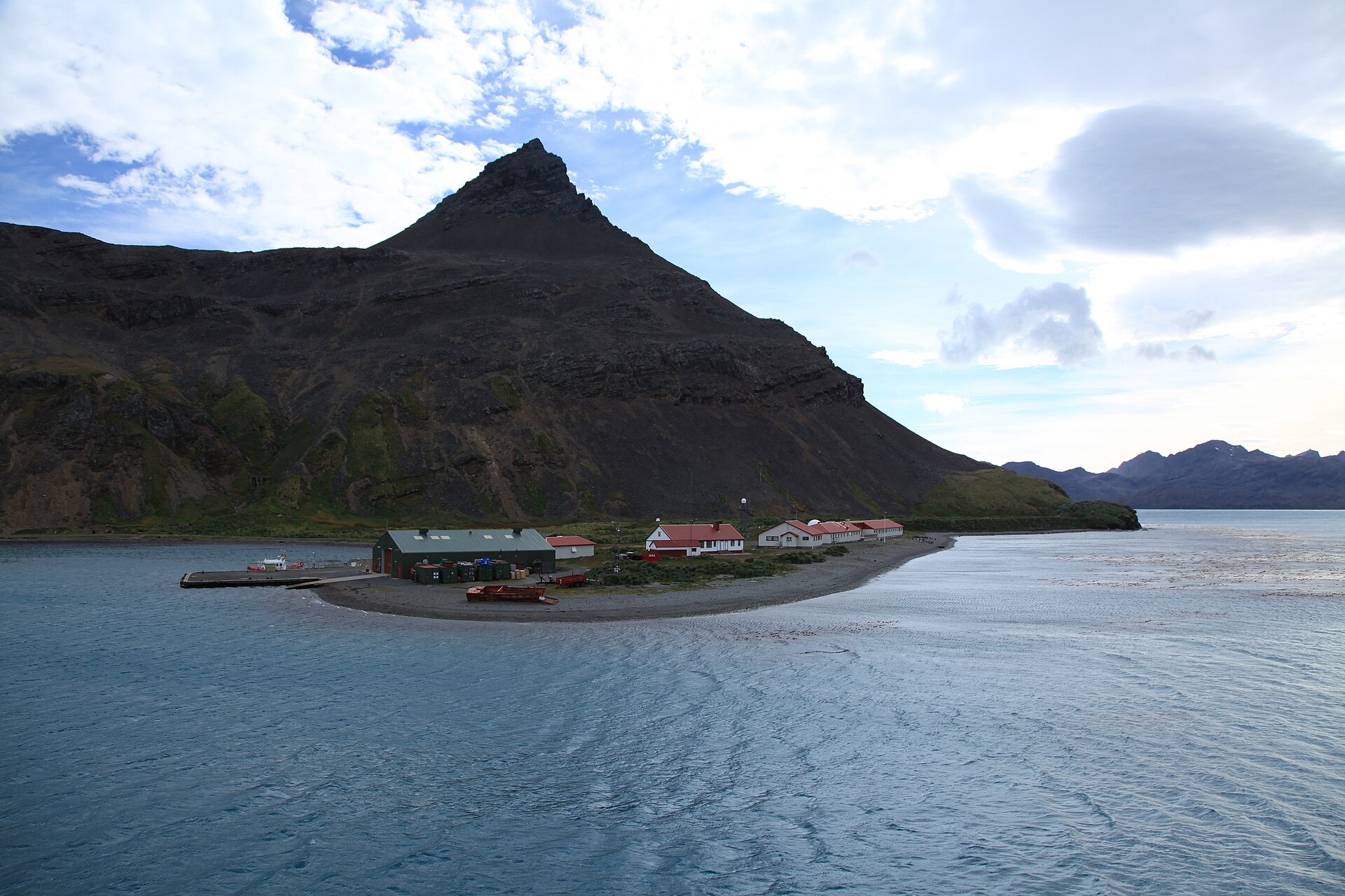 King Edward Point beneath a dark triangular mountain beside Cumberland Bay