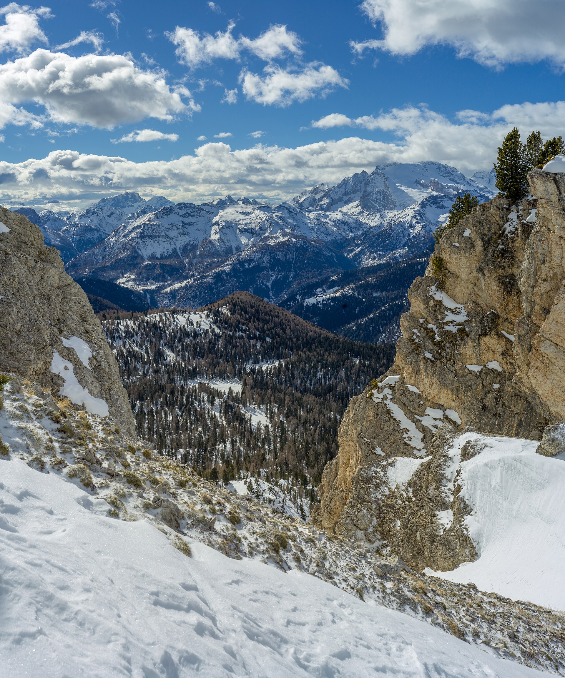 A snowy Dolomite couloir framing Marmolada above the Fodom valley