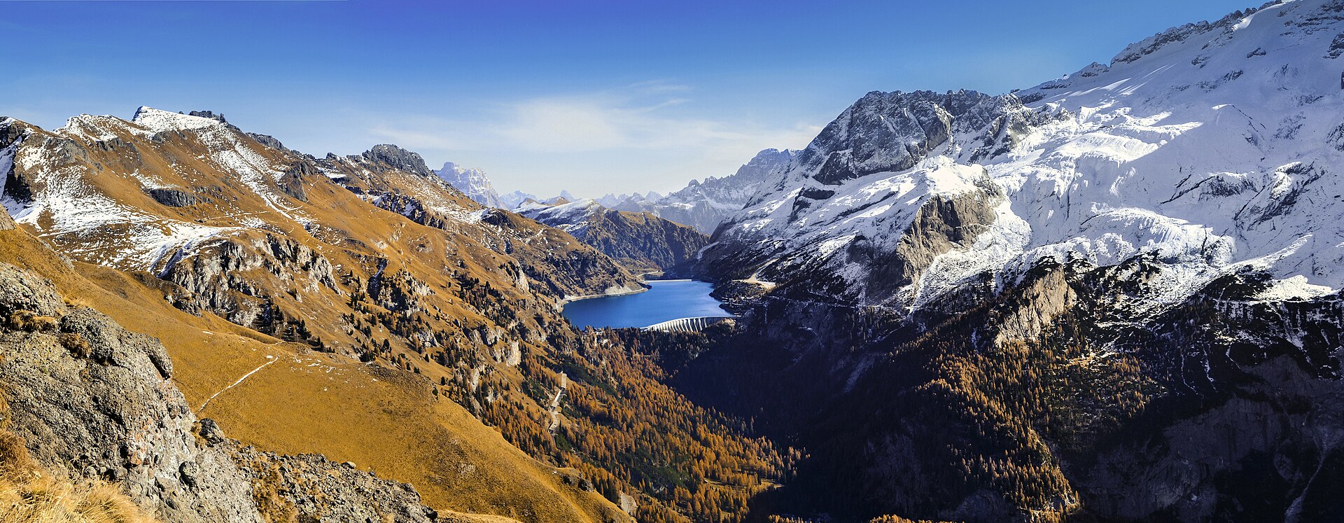 Early winter snow on Marmolada above Lake Fedaia and the Padon ridge