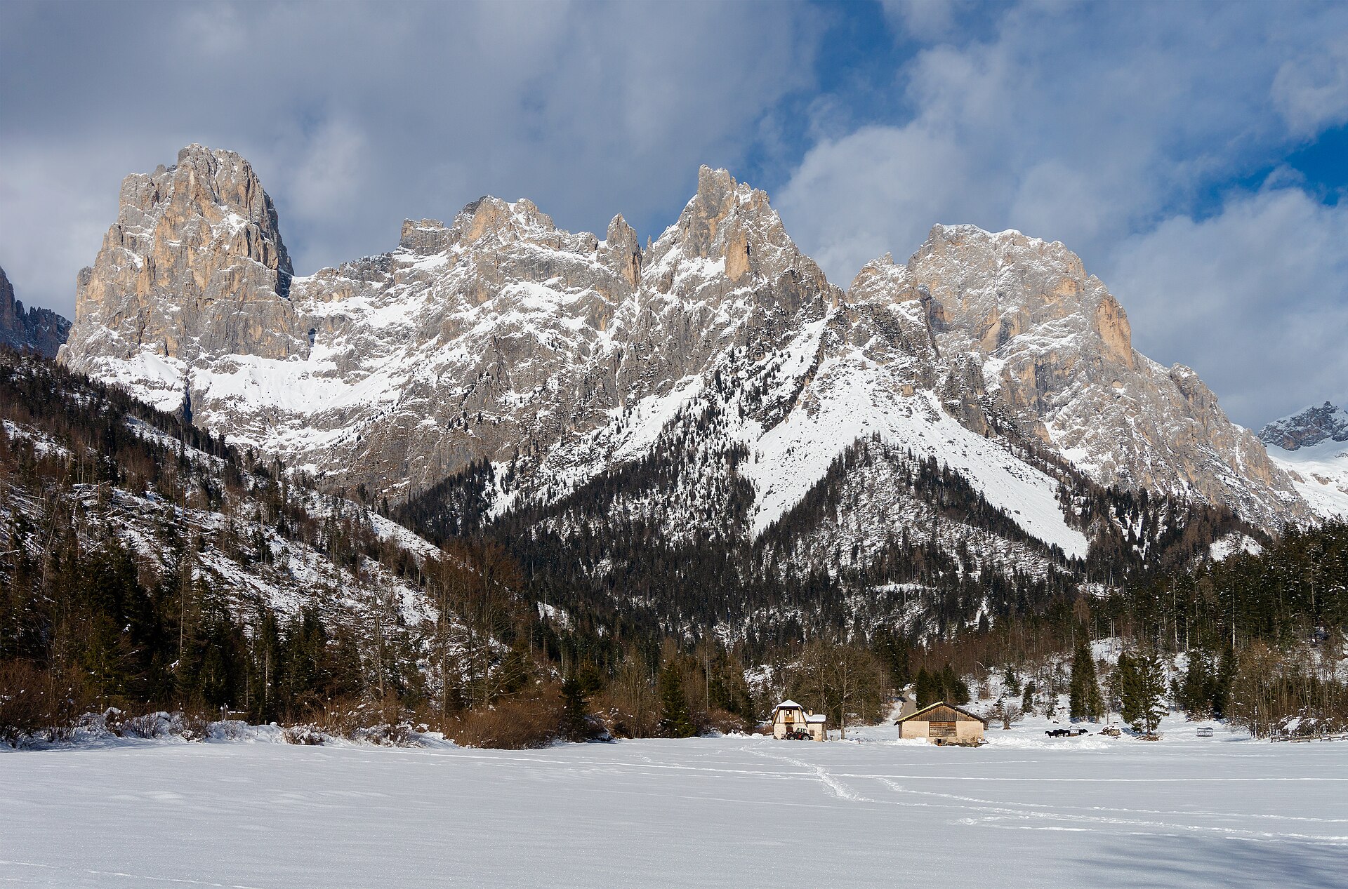 Snow-covered Pale di San Martino seen from the Muse Fedaie path