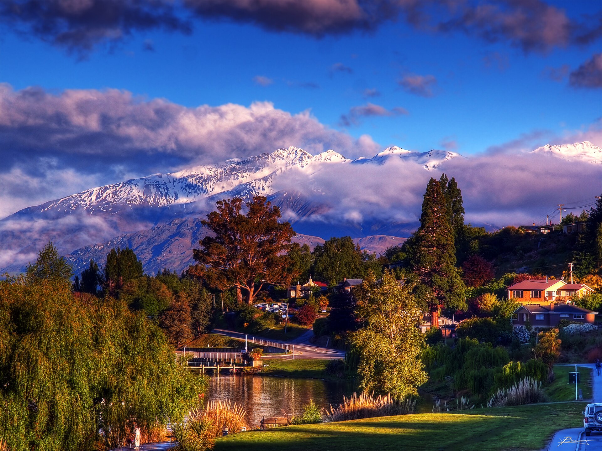 Early light over Wānaka with snowy mountains behind the town