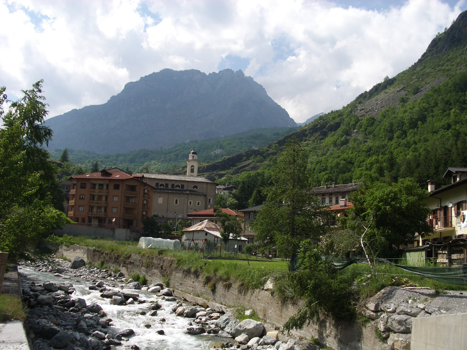 The stone village of Acceglio beneath mountains in Valle Maira