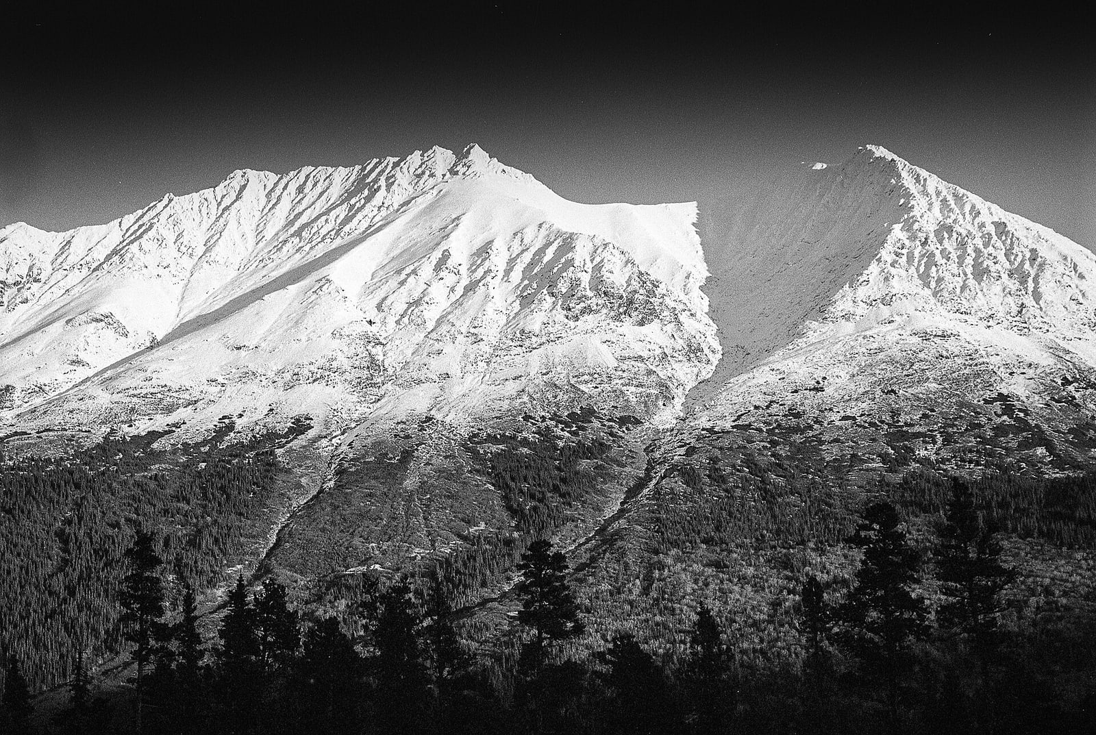 Snow-streaked mountains near Tutshi Lake in the Yukon