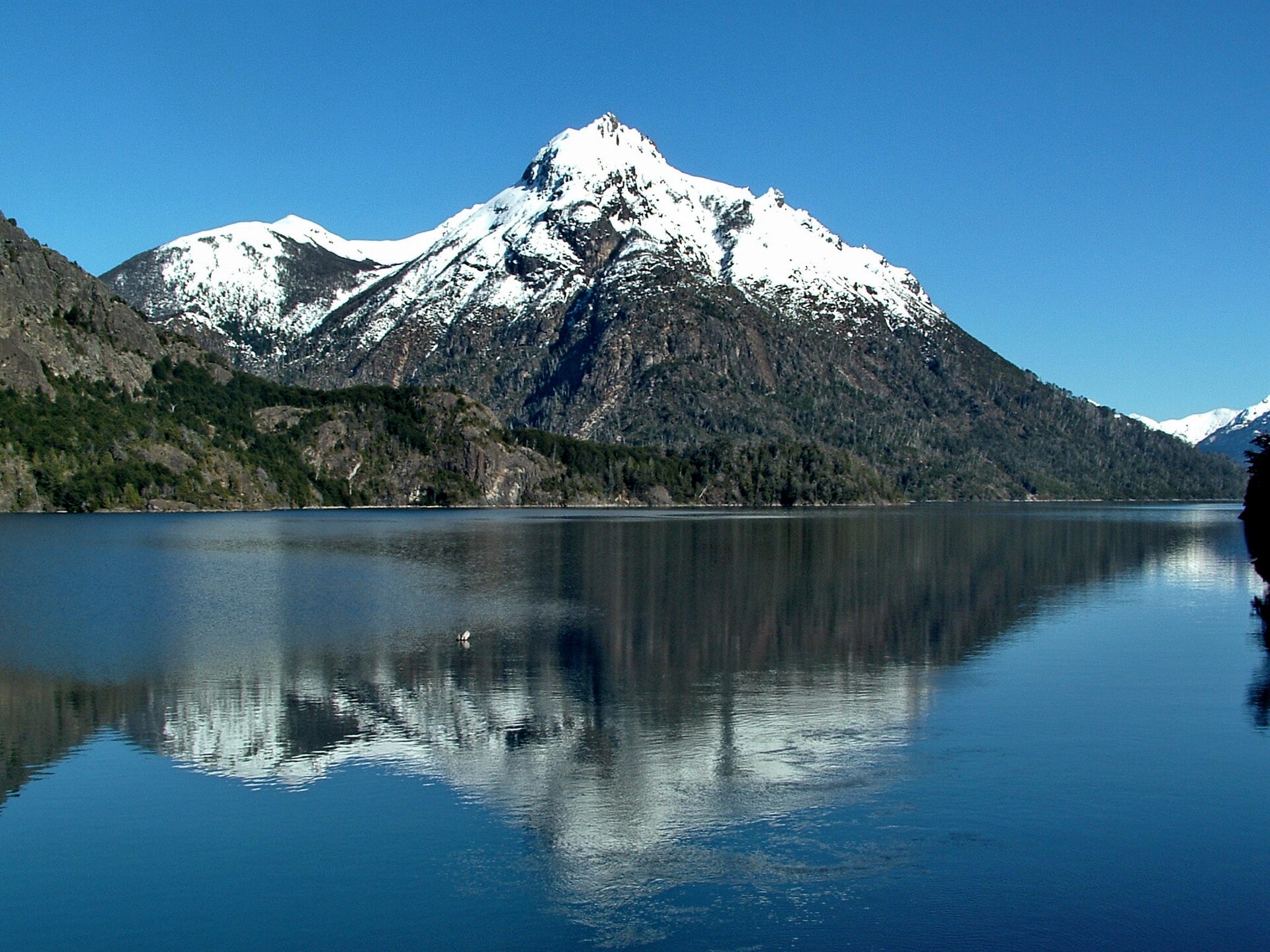 Cerro Capilla reflected in the blue waters of Nahuel Huapi