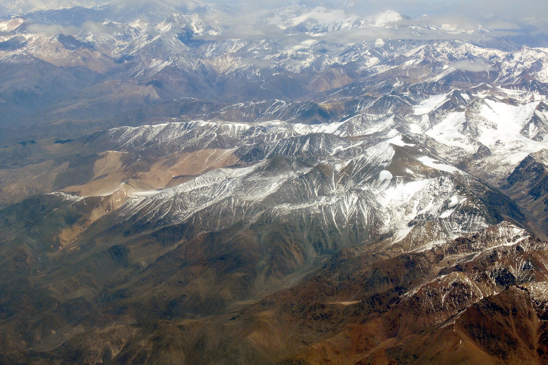 Aerial view across the high, snow-streaked Cordón del Plata