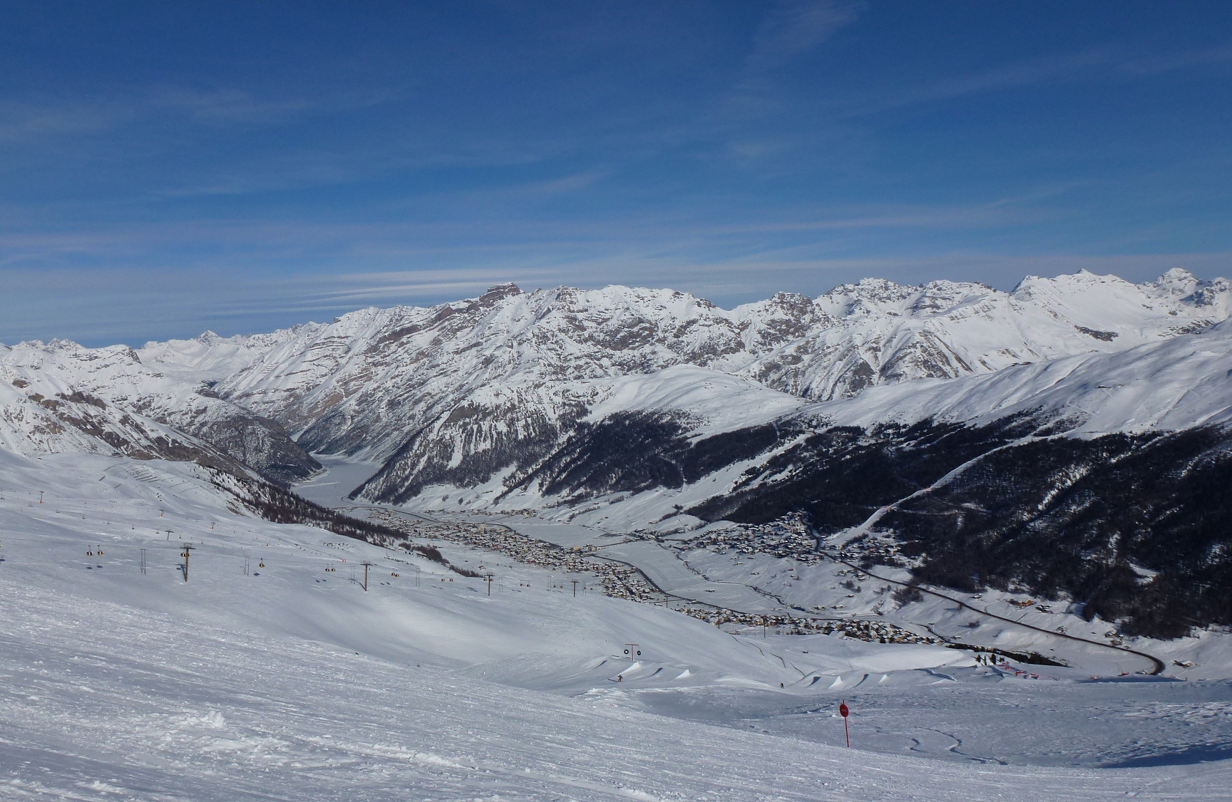 Livigno spread across a snowy Alpine valley beneath high peaks